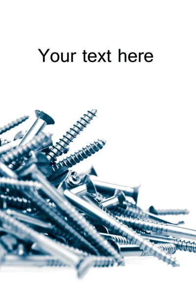 Metalliska skruvar isolerad på vit med utrymme för text — Stockfoto