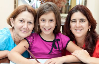 Three generations of latin women at home clipart