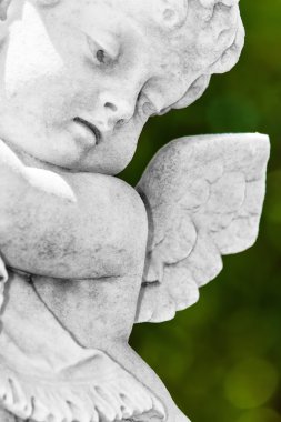 Beautiful old statue of a little infant angel clipart