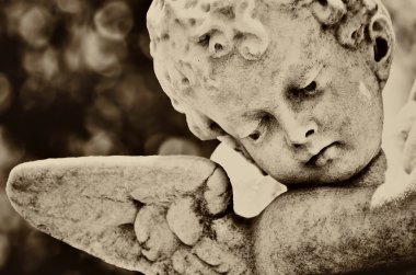 Beautiful old statue of a little infant angel clipart