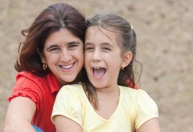 Latin girl with her beautiful young mother