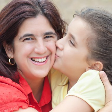 Latin girl with her beautiful young mother