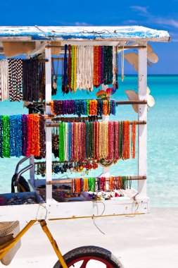 Cart selling souvenirs on the cuban beach of Varadero clipart