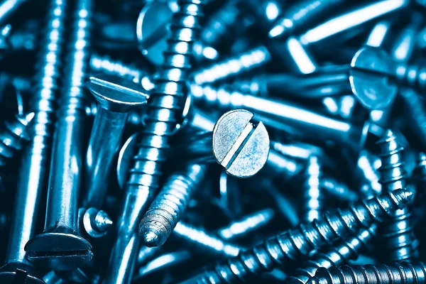 Metallic screws background — Stock Photo, Image