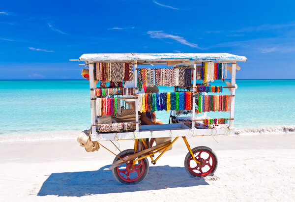Cart selling typical souvenirs on the famous cuban beach of Varadero