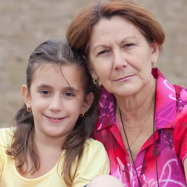 Latin girl with her grandmother in a park — Stock Photo, Image