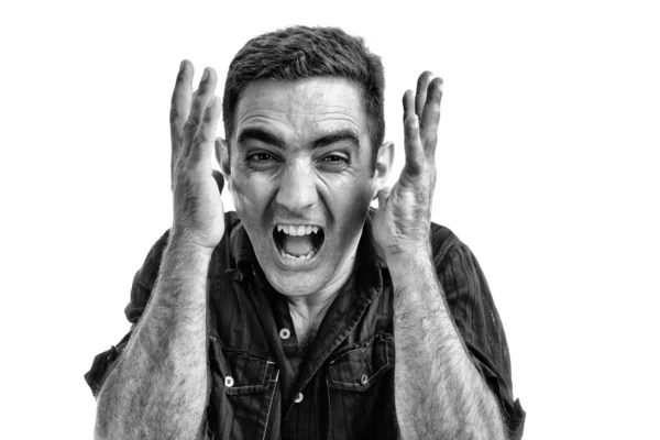 Gwałtowny hiszpanin człowiek krzyczy z zły lub rozpaczliwe twarzy — Zdjęcie stockowe