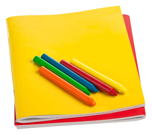 Cadernos coloridos e outros materiais escolares isolados em branco — Fotografia de Stock