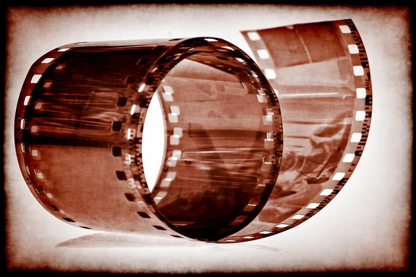 Old film tape on a vintage sepia background