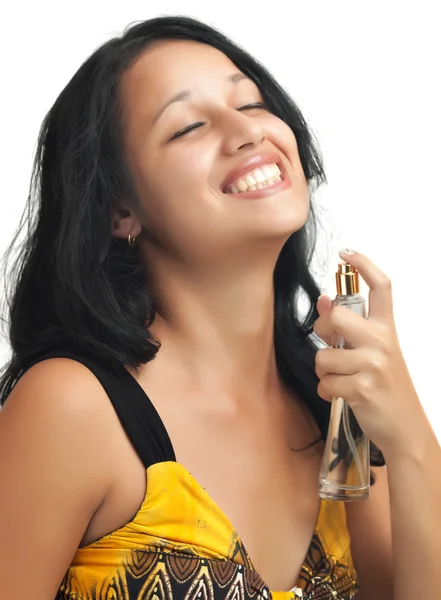 Menina hispânica bonita usando perfume isolado no branco — Fotografia de Stock
