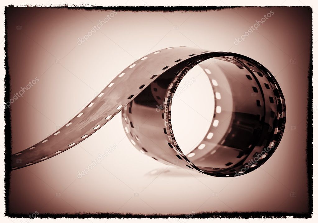Photographic film reel on a vintage sepia background
