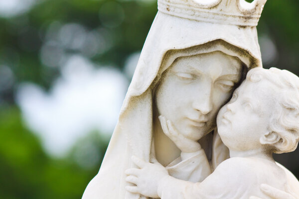 Beautiful marble statue of the Vigin Mary carrying the baby Jesus