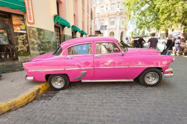 Classic car in front of El Floridita in Havana clipart