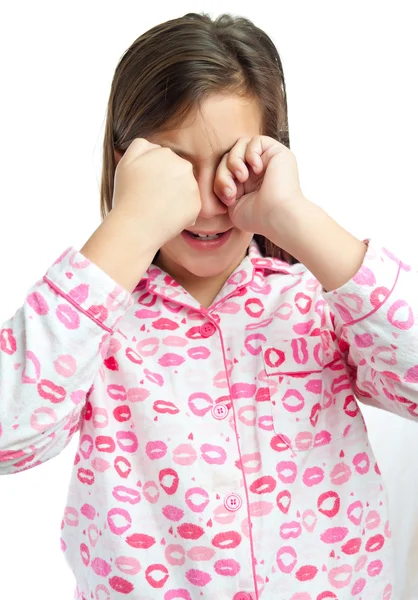 Menina sonolenta vestindo pijama isolado no branco — Fotografia de Stock