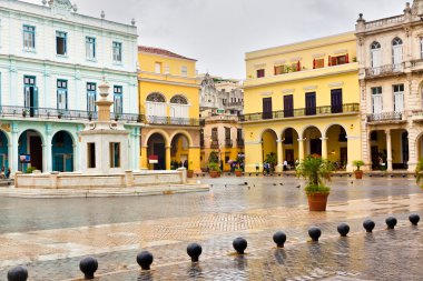 Raining in La Plaza Vieja,a landmark in Old Havana clipart