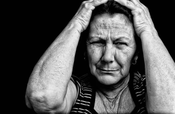 Grunge portrait of an old stressed woman — Stock Photo, Image
