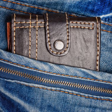 Jeans with a leather wallet on its pocket clipart