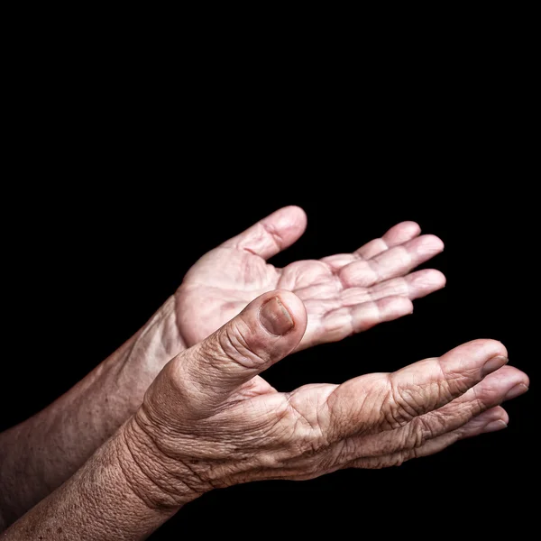 Wrinkled old hands begging — Stock Photo, Image