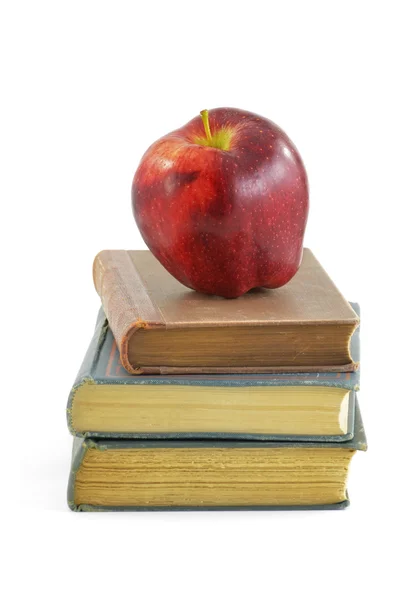 stock image Apple on old books