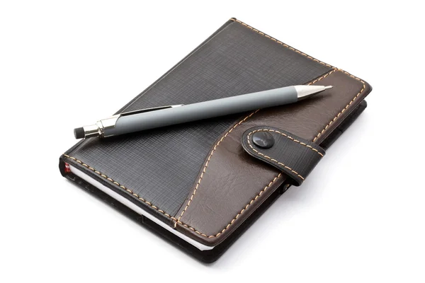 Siyah notebook ve mekanik kurşun kalem — Stok fotoğraf