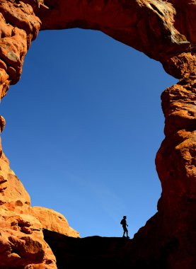 Man Hiking in Arches National Park clipart