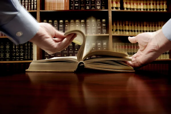 Hand on Book in Library — Stock Photo, Image