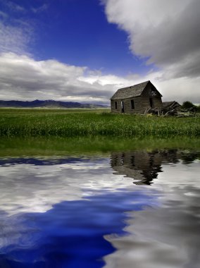 Old Homestead in Field Reflection clipart