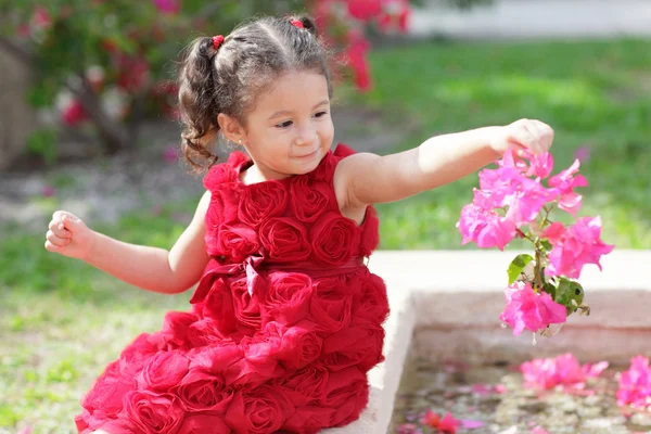 Child in a flower pattern dress — Stock Photo, Image
