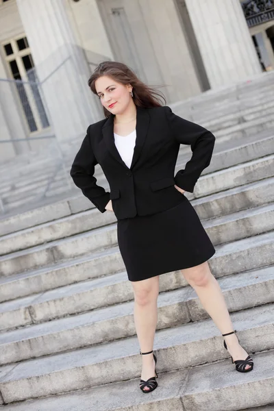 Businesswoman with hands on hips — Stock Photo, Image