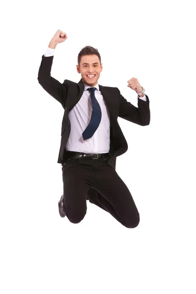 Чрезвычайно взволнованный бизнесмен прыгает — стоковое фото