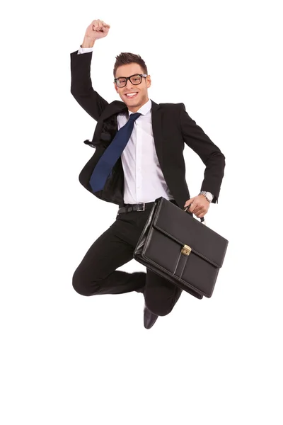 Hombre de negocios con maletín saltando — Foto de Stock