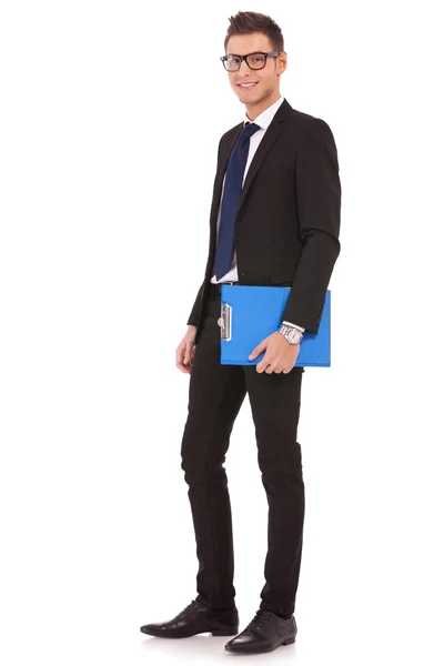 Young business man with a blue clipboard — Stock Photo, Image