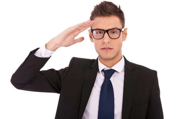 Business man wearing glasses gives salute — Stock Photo, Image
