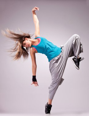 Beautiful dance pose of a young woman clipart