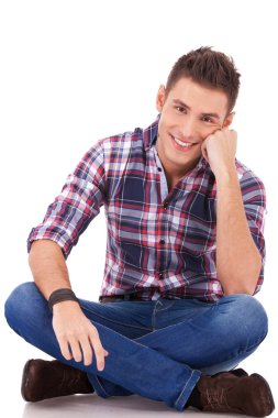 Happy man seated on studio clipart