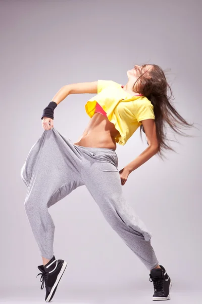 Woman dancer in a full of energy dance pose — Stock Photo, Image