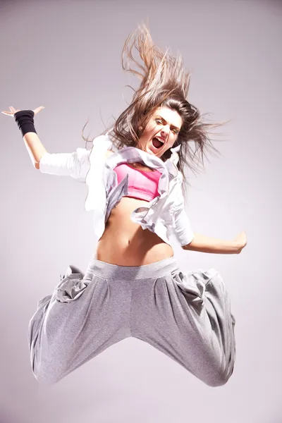 Cool woman dancer jumping in mid air — Stock Photo, Image