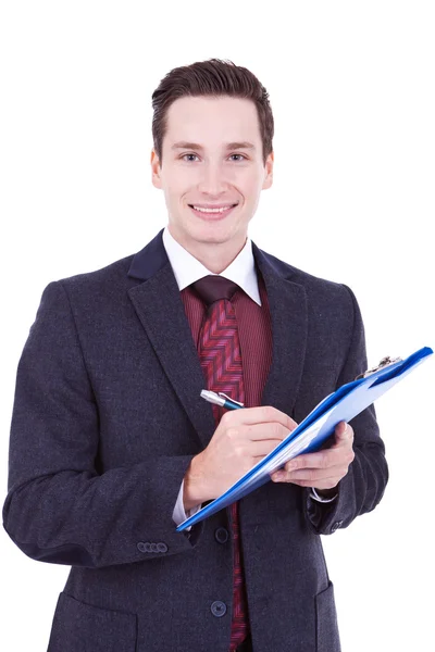 Hombre de negocios escribiendo en portapapeles —  Fotos de Stock