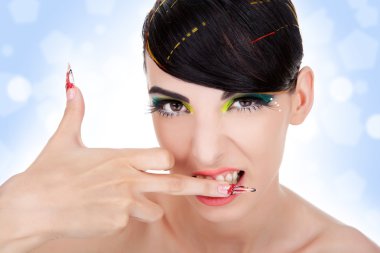 Sexy aggressive woman biting her middle finger clipart