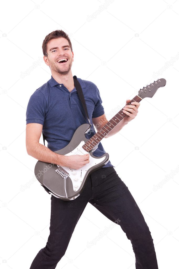 Smiling man playing an electric guitar