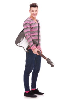 Rock star with an electric guitar smiling clipart