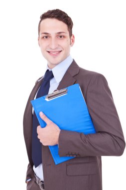 Businessman smiles with clipboard in his hand clipart