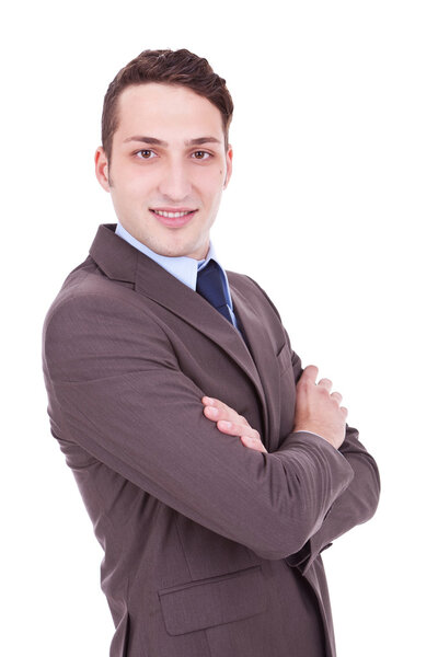 Portrait of a business man isolated on white background. Studio shot of a young confident businessman with arms crossed