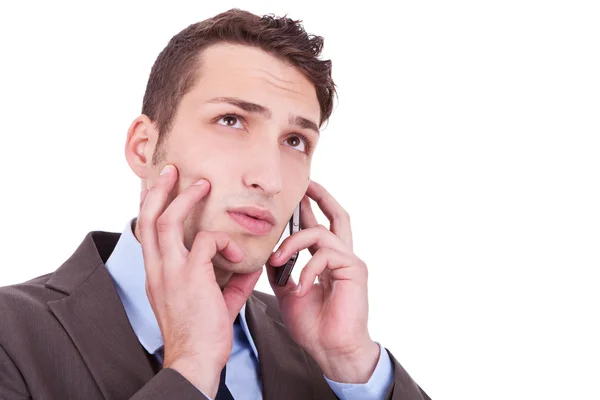 Hombre de negocios contemplativo hablando por teléfono — Foto de Stock
