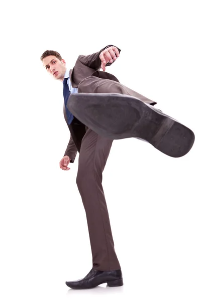 ビジネスの男性を蹴る — ストック写真