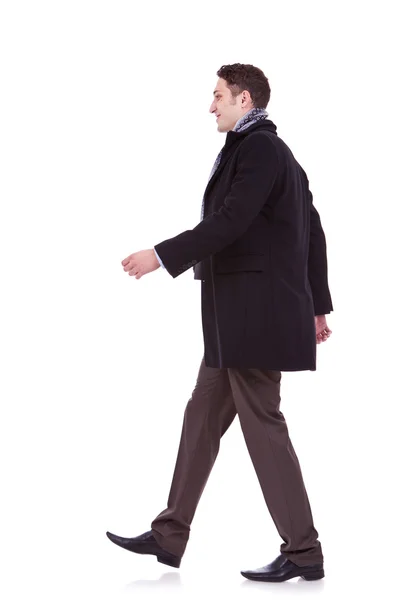 Young business man walking forward — Stock Photo, Image