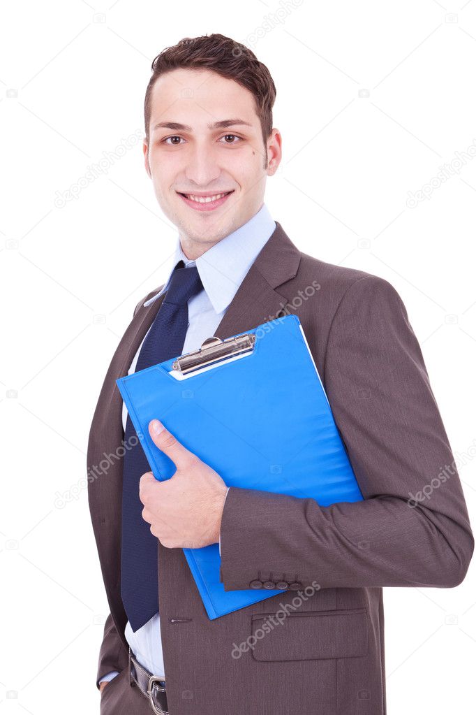 Businessman smiles with clipboard in his hand