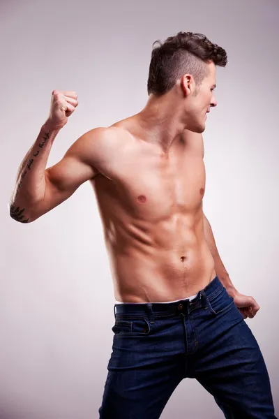 Young flexed muscular dancer — Stock Photo, Image