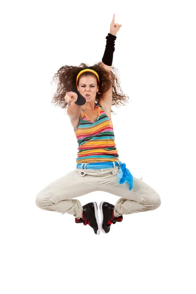 Kobieta tancerz skoki i ten obecnie poiting — Zdjęcie stockowe