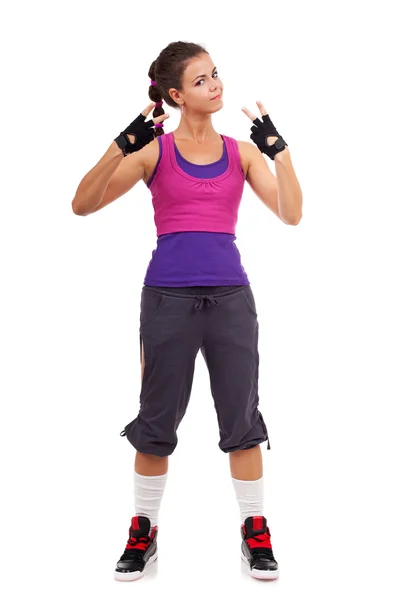 Sporty woman gesturing a win symbol — Stock Photo, Image
